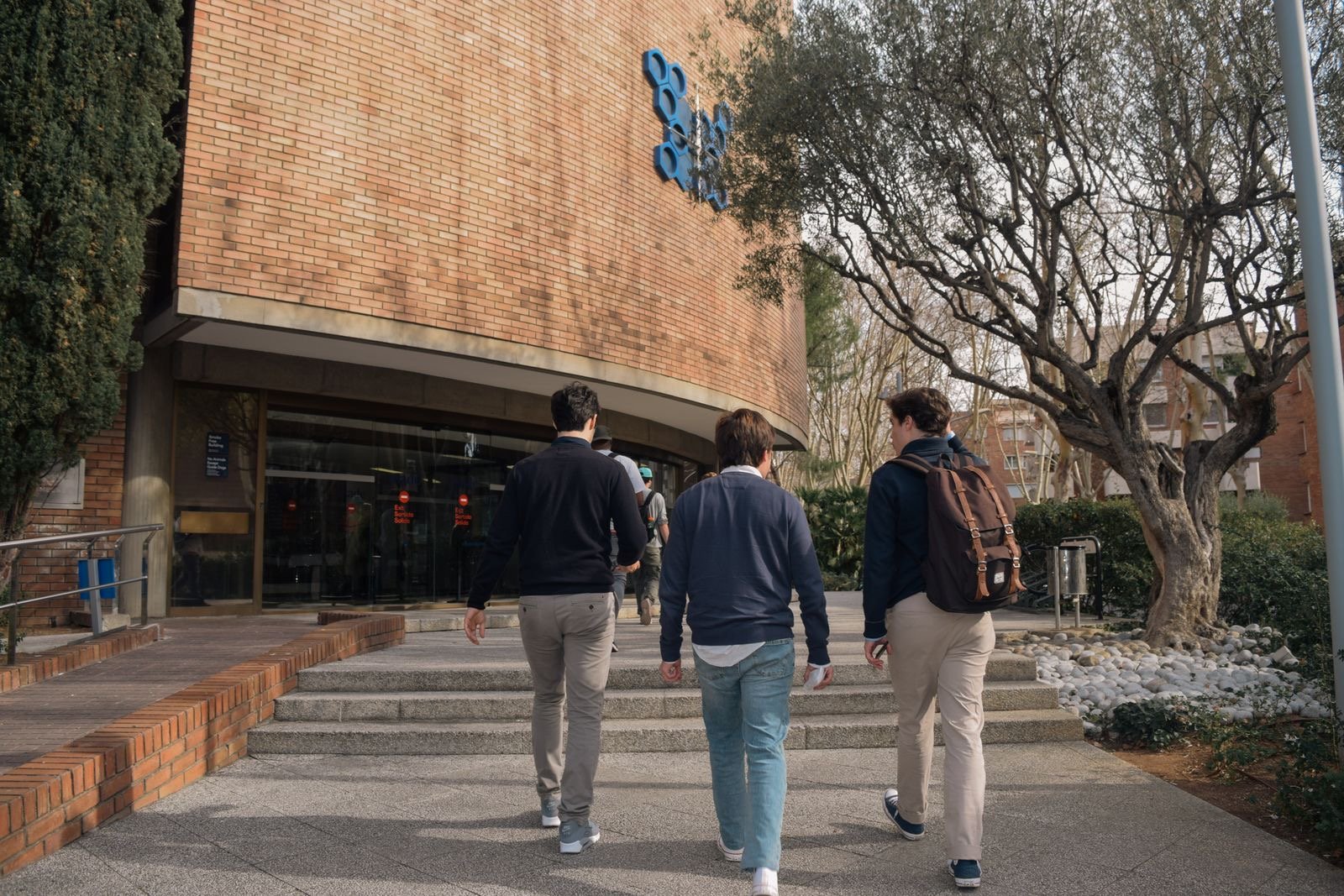 Students walking into a university entrance in Barcelona